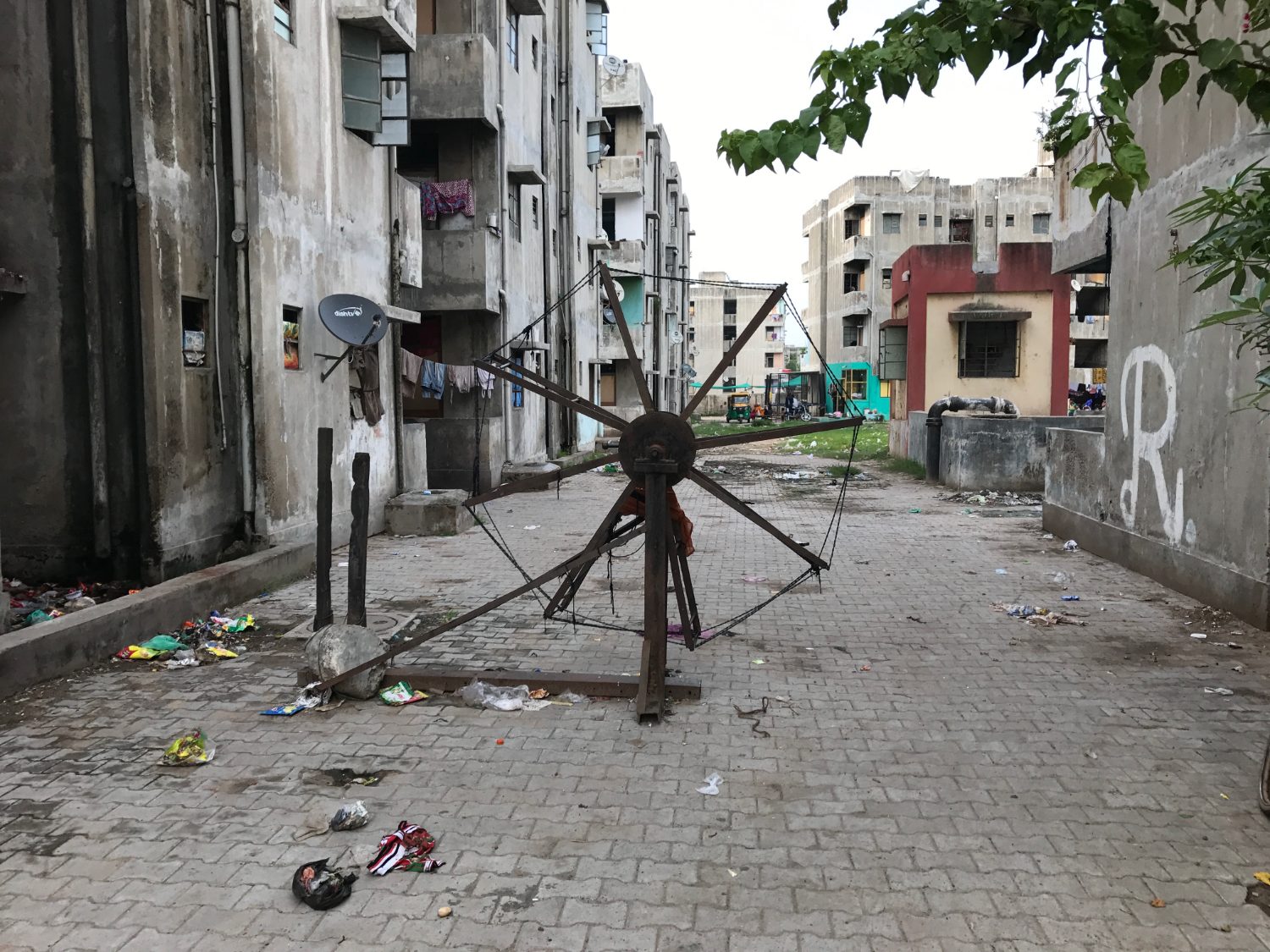 A broken roundabout in a paved courtyard