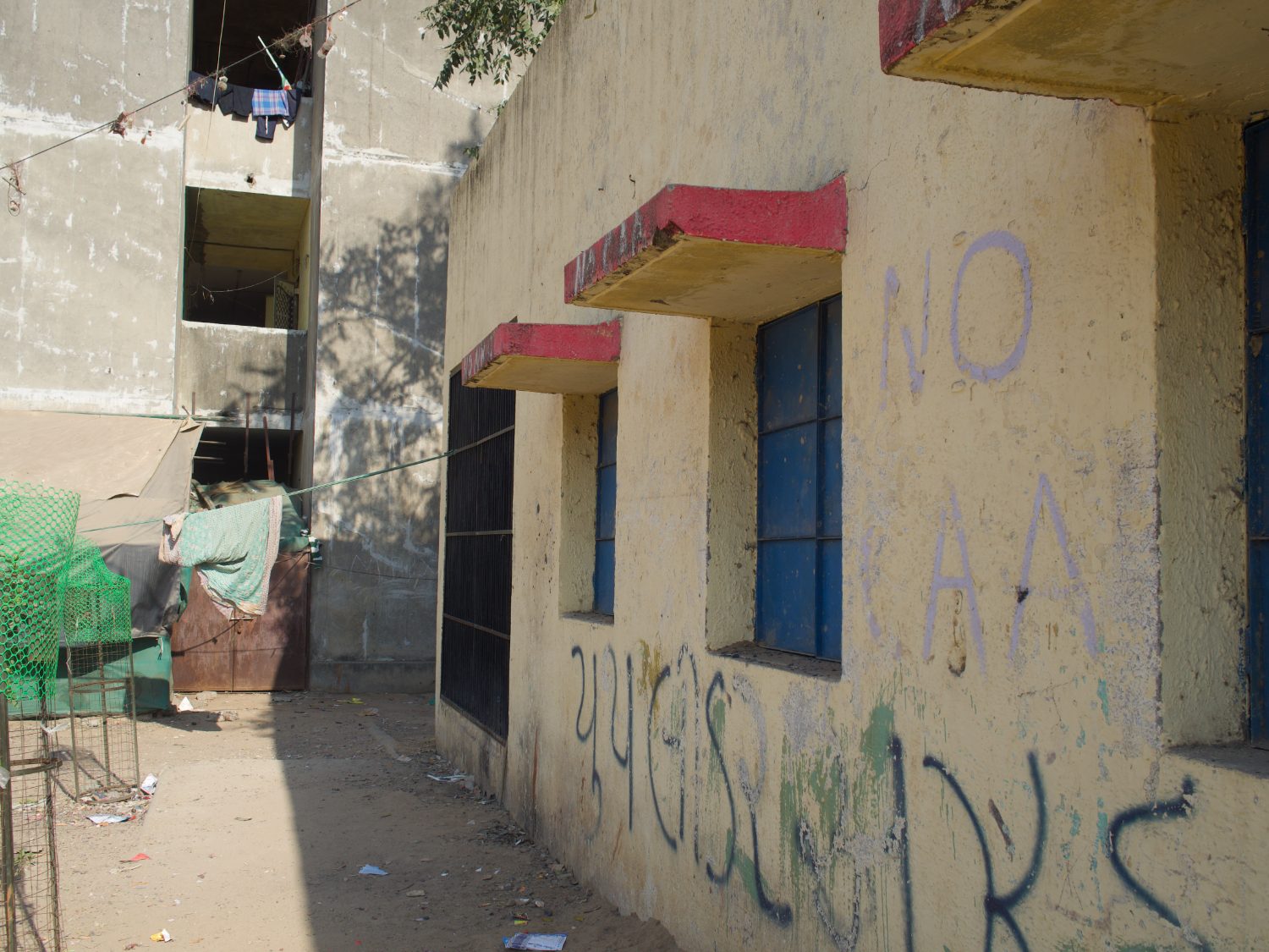 ‘No CAA’ graffiti on a settlement wall