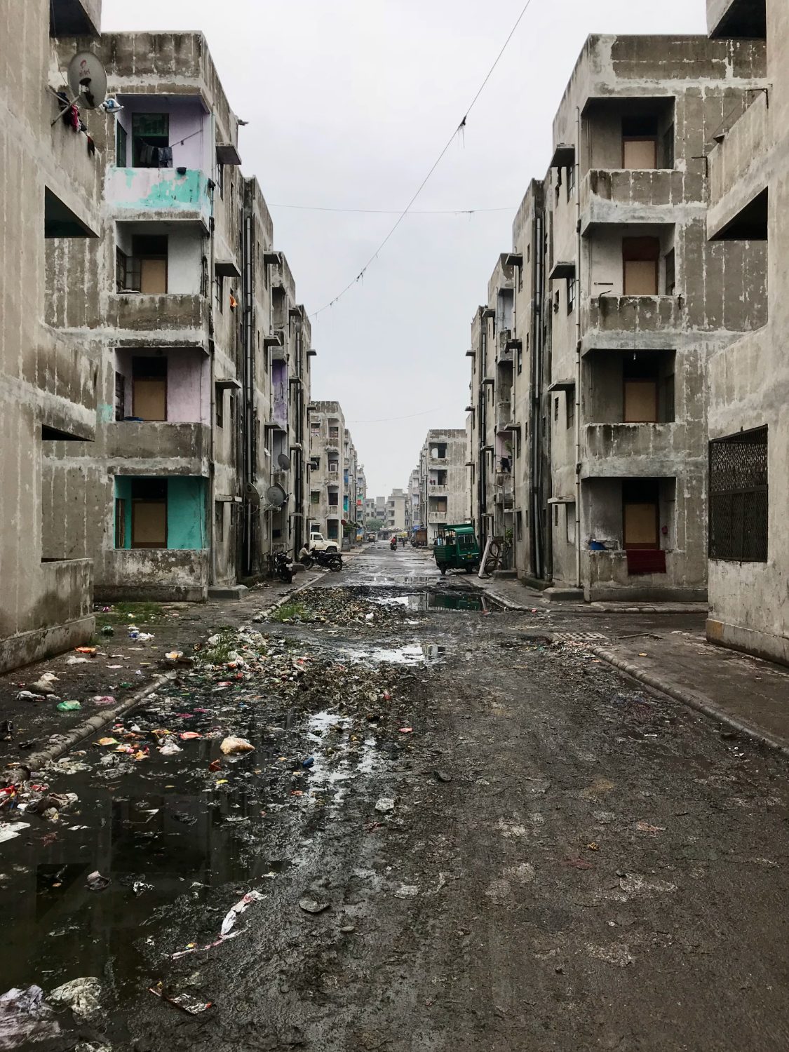 An alley between resettlement blocks after rain